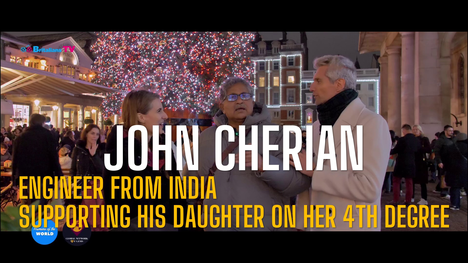 You are currently viewing Humans of the World – S12E23 – LONDON – John Cherian Engineer from India supporting his daughter on her 4th degree
